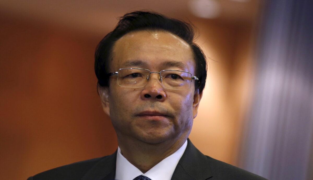 China Huarong Asset Management Co Chairman Lai Xiaomin listens to a question from a reporter during the debut of the company at the Hong Kong Exchanges in Hong Kong, China, on Oct. 30, 2015. (Bobby Yip/Reuters)