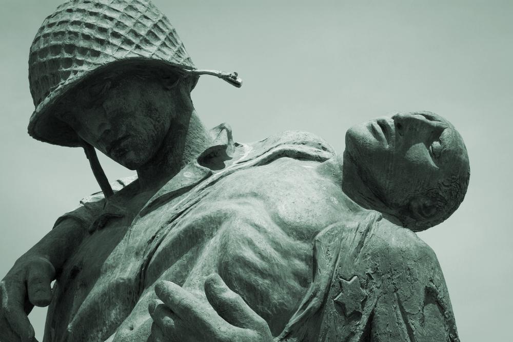 Close-up view of the Liberation Monument, a memorial to the Holocaust depicting a U.S. soldier carrying a Nazi death camp survivor at Liberty State Park. (Glynnis Jones/Shutterstock)