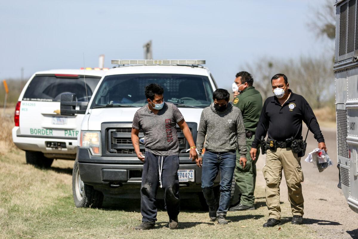 Border Patrol agents apprehend a busload of illegal immigrants in Penitas, Texas, on March 10, 2021. (Charlotte Cuthbertson/The Epoch Times)