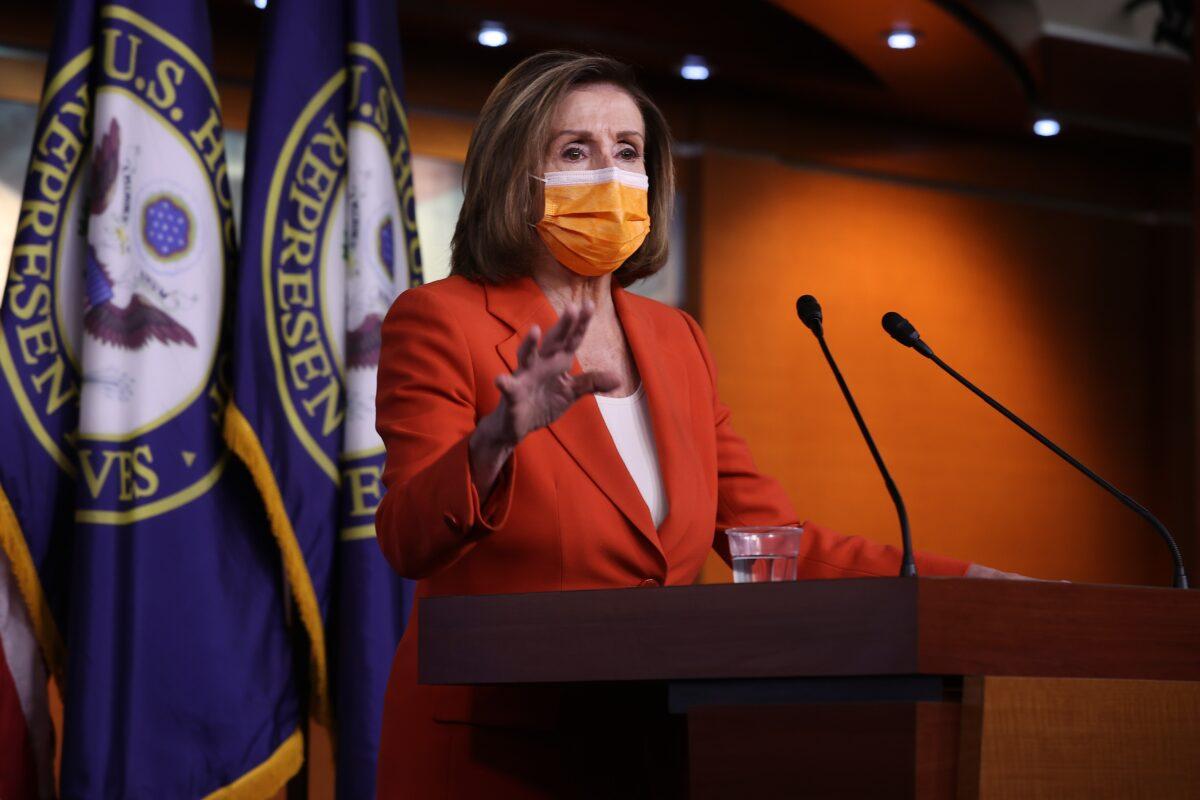 Speaker of the House Nancy Pelosi (D-CA) holds her weekly news conference one day after Congress passed a $1.9 trillion COVID-related stimulus package at the U.S. Capitol Visitors Center, in Washington, on March 11, 2021. (Chip Somodevilla/Getty Images)