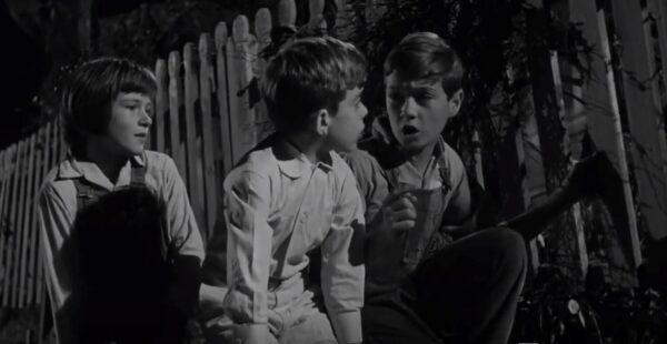 (L–R) Scout (Mary Badham), Dill (John Megna), and Jem (Phillip Alford) spend the summer interested in their neighbor “Boo” Radley, in “To Kill a Mockingbird.” (Universal Pictures)