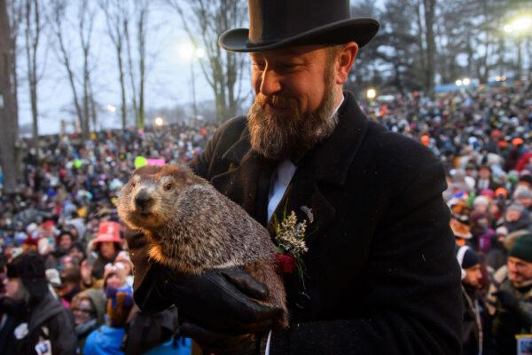 Handler AJ Dereume holds Punxsutawney Phil during the 133rd annual Groundhog Day festivities on Feb. 2, 2019, in Punxsutawney, Pa. (Jeff Swensen/Getty Images)