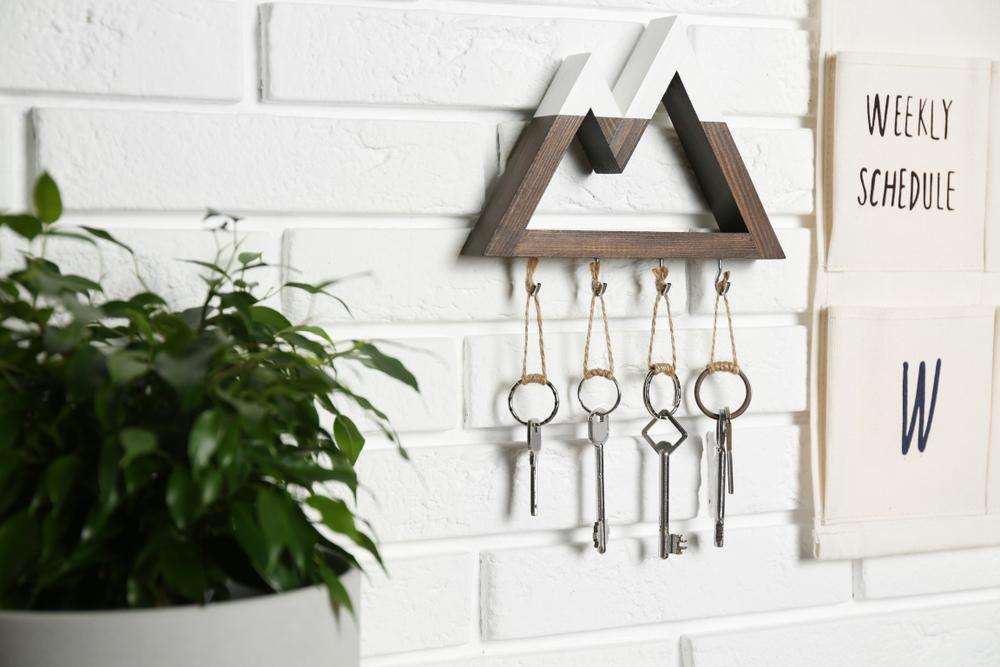 Add fun hooks and shelves to your entry space to keep keys, mail, and other items sorted. (New Africa/Shutterstock)