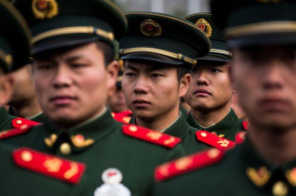 People's Liberation Army soldiers participate in a ceremony in this file photo. (Chandan Khanna/AFP/Getty Images)
