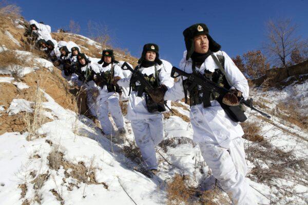 Chinese soldiers take part in a winter training session in Heihe, northeast China, on Jan. 28, 2015. (STR/AFP via Getty Images)