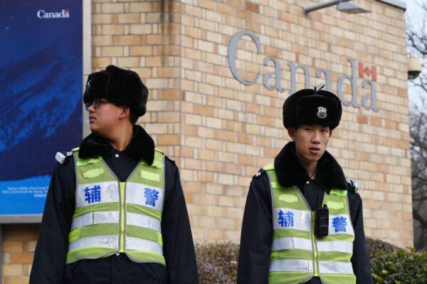 Police officers stand guard outside the Canadian embassy in Beijing on Jan. 27, 2019. (Greg Baker/AFP/Getty Images)
