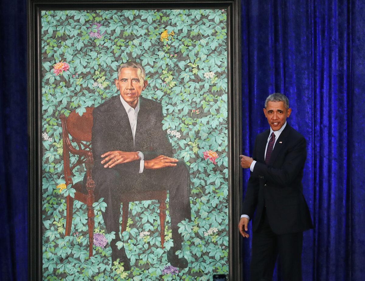 Former President Barack Obama stands next to his newly unveiled portrait during a ceremony at the Smithsonian's National Portrait Gallery in Washington on Feb. 12, 2018. (Mark Wilson/Getty Images)