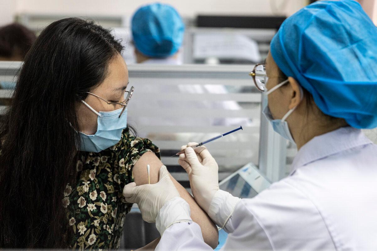 Residents receive the COVID-19 vaccine at a community hospital on April 2, 2021 in Wuhan, Hubei Province, China. (Photo by Getty Images)
