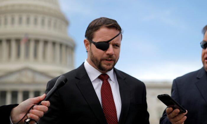 Rep.-elect Dan Crenshaw (R-Texas) talks with reporters on Capitol Hill in Washington on Nov. 14, 2018. (Carlos Barria/Reuters)