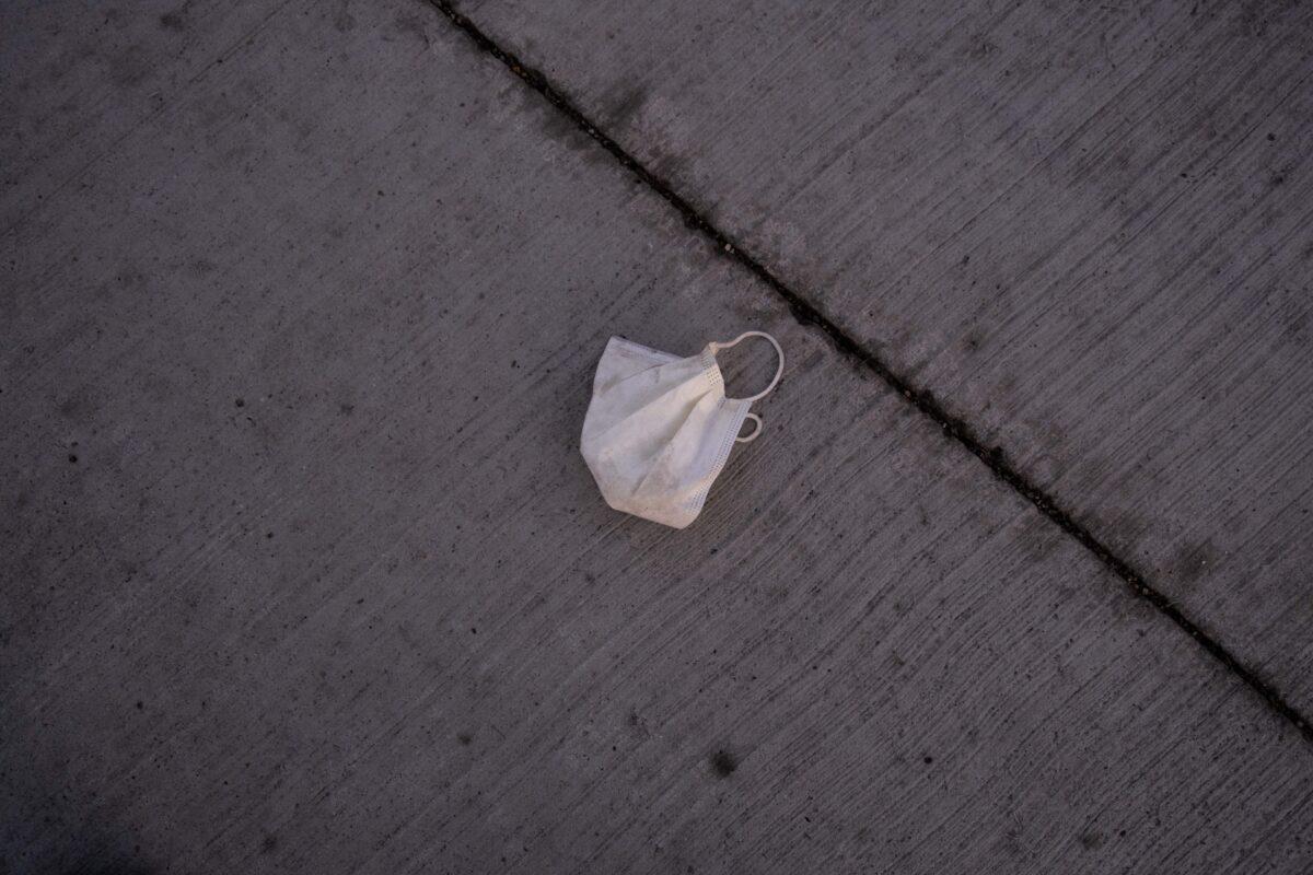 A medical mask is seen on the ground in Ann Arbor, Mich., on April 15, 2020. (Seth Herald/AFP via Getty Images)