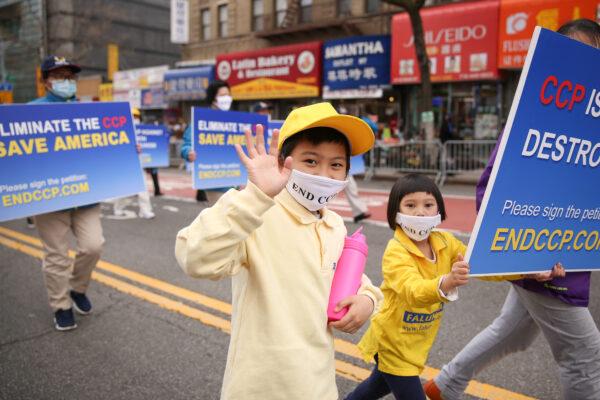 Falun Gong practitioners take part in a parade in Flushing, New York, on April 18, 2021, to commemorate the 22nd anniversary of the April 25th peaceful appeal of 10,000 Falun Gong practitioners in Beijing. (Samira Bouaou/The Epoch Times)