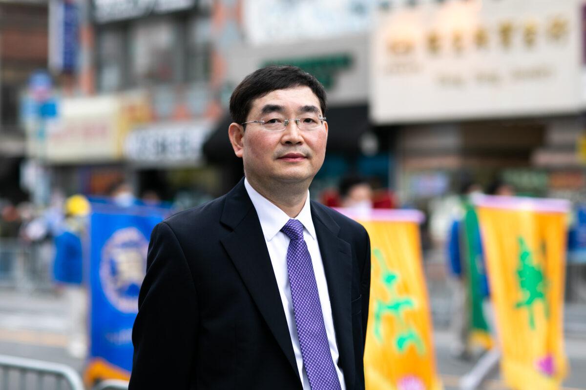 Falun Gong practitioner Shi Caidong in Flushing, New York on April 18, 2021. (Chung I Ho/The Epoch Times)