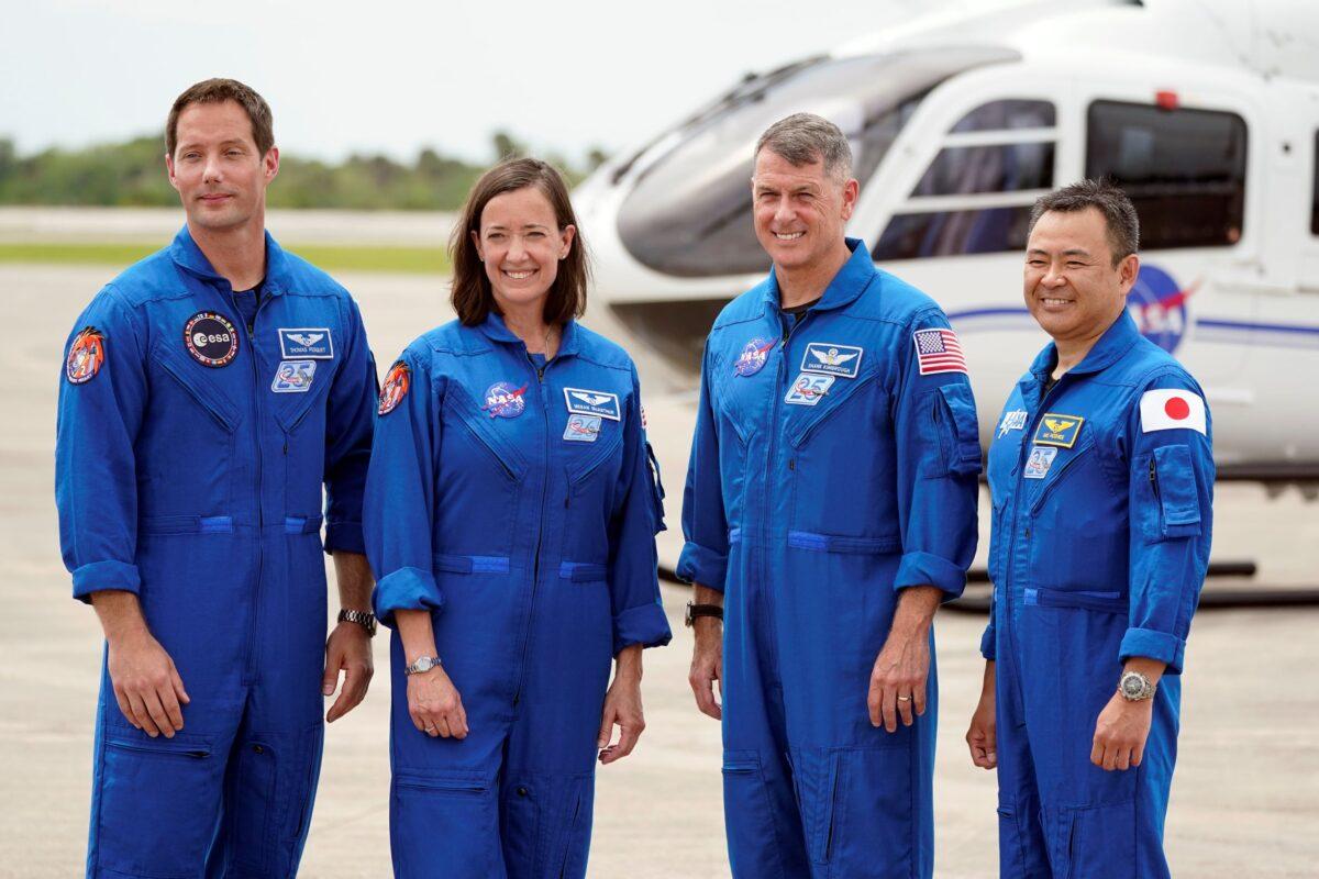 SpaceX Crew 2 members, from left, European Space Agency astronaut Thomas Pesquet, NASA astronauts Megan McArthur and Shane Kimbrough, and Japan Aerospace Exploration Agency astronaut Akihiko Hoshide gather at the Kennedy Space Center in Cape Canaveral, Fla., on April 16, 2021. (John Raoux/AP Photo)