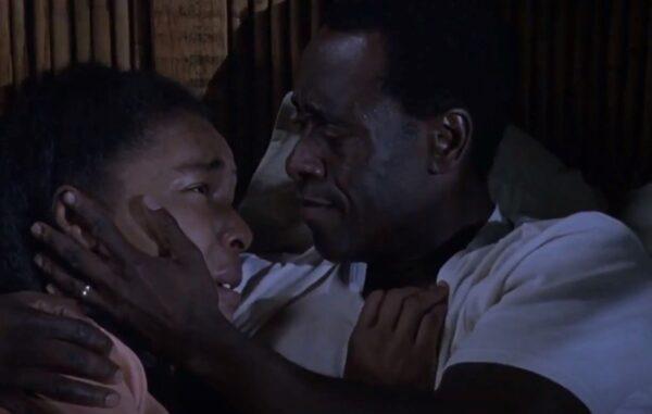 Tatiana (Sophie Okonedo) is comforted by her husband, Paul (Don Cheadle), in one of the family’s close calls. (United Artists and Lions Gate Films)