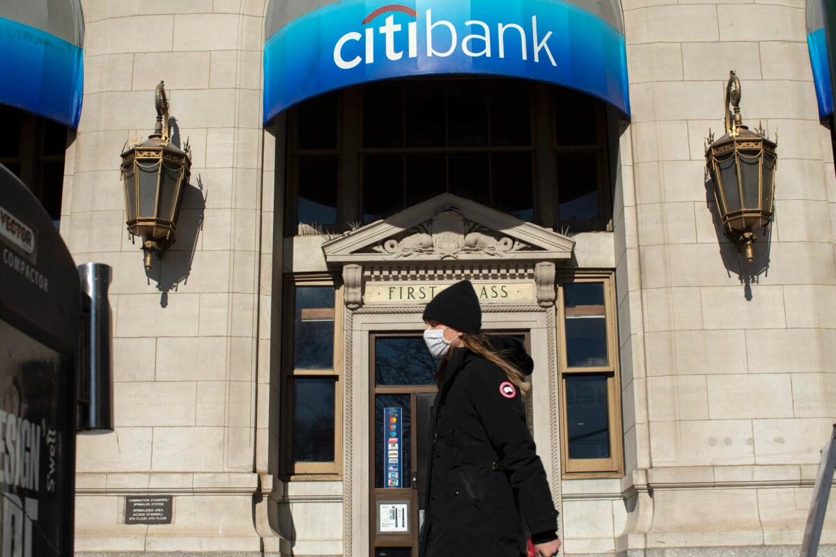 A woman walks past a branch of Citibank in the financial district in New York on Feb. 8, 2021. (KENA BETANCUR/AFP via Getty Images)