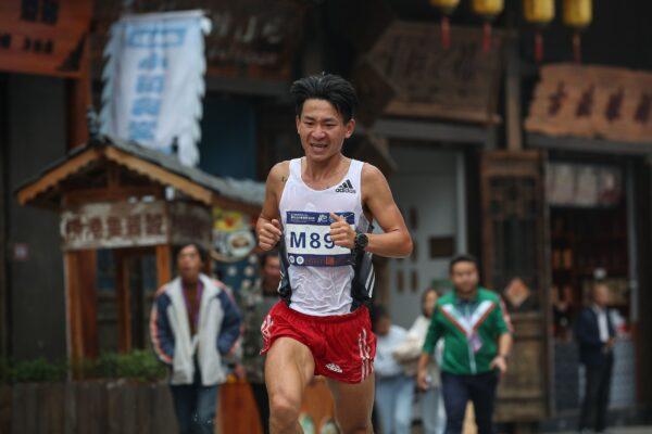 A runner is taking part in the Guizhou Tour of Leigong Mountain 100km International Marathon in Danzhai in China's southwestern Guizhou Province on Nov. 17, 2019. (STR/AFP via Getty Images)