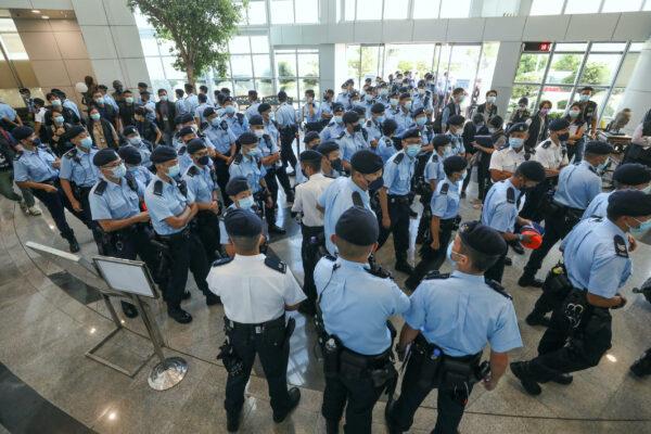 Police officers conduct a raid at the Apple Daily office in Hong Kong on June 17, 2021. (Apple Daily via Getty Images)