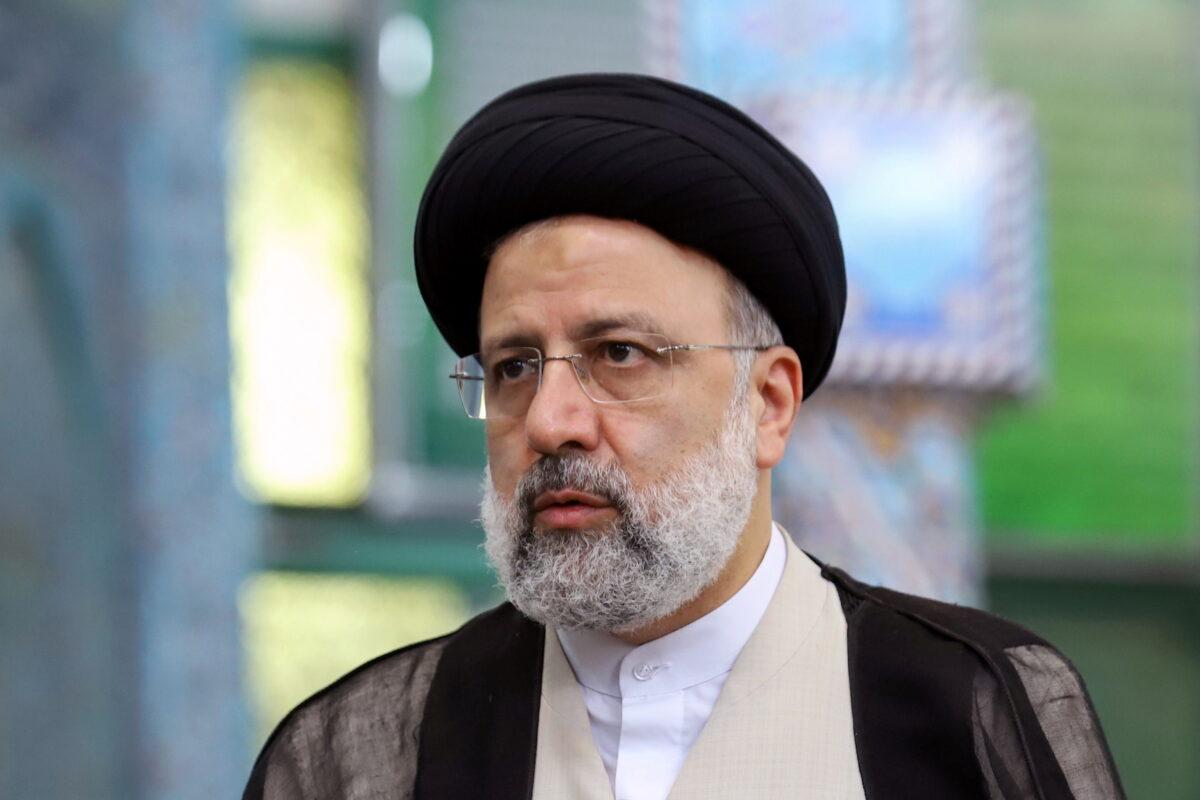 Presidential candidate Ebrahim Raisi looks on at a polling station during presidential elections in Tehran, Iran, on June 18, 2021. (Majid Asgaripour/West Asia News Agency via Reuters)