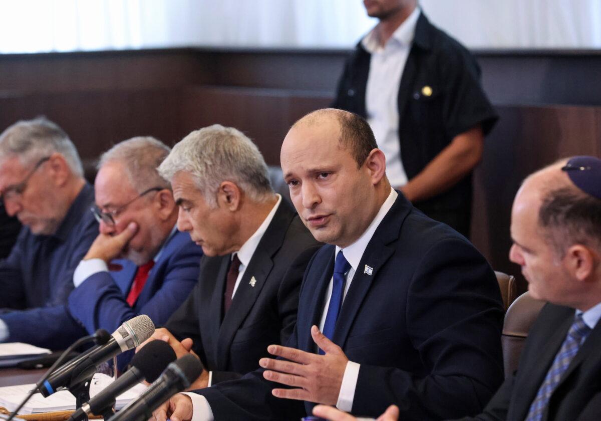 Israeli Prime Minister Naftali Bennett speaks as he chairs the first weekly cabinet meeting of his new government in Jerusalem, on June 20, 2021. (Emmanuel Dunand/Pool via Reuters)