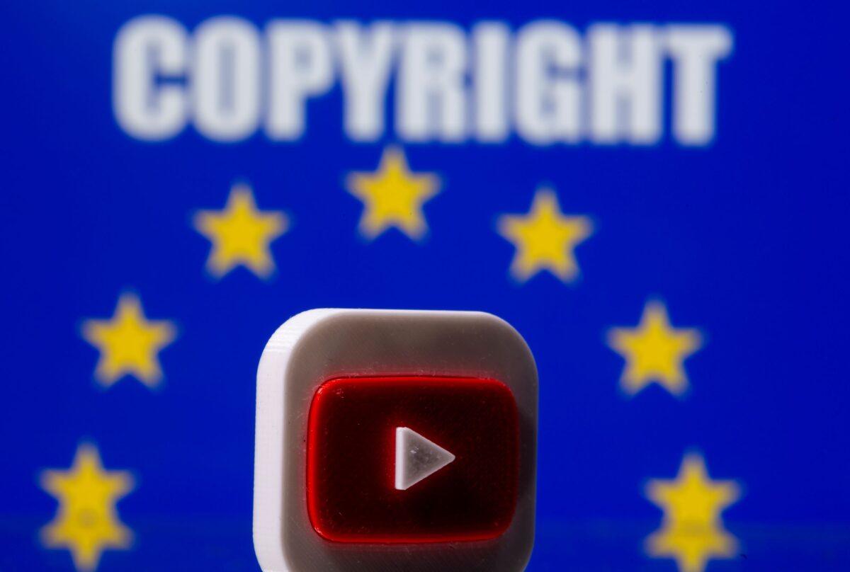 A 3D printed Youtube logo is seen in front of a displayed EU flag and copyright words in this illustration (Dado Ruvic/Illustration/Reuters)