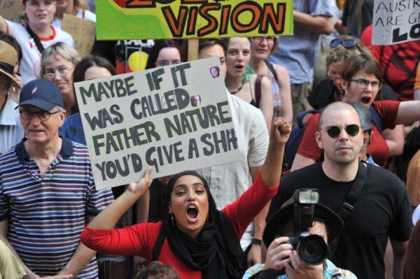 Participants hold placards as they take part in a demonstration demanding the government take immediate action against climate change in Sydney, Australia, on Jan. 10, 2020. (Mohammed Farooq/AFP via Getty Images)