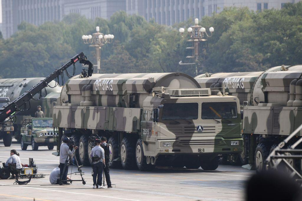 Military vehicles carrying DF-31AG intercontinental ballistic missiles participate in a military parade at Tiananmen Square in Beijing on Oct. 1, 2019, (Greg Baker/AFP via Getty Images)