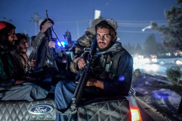 Members of the Taliban on patrol in a pickup truck in Kabul, Afghanistan, on Sept. 30, 2021. (Bulent Kilic/AFP via Getty Images)