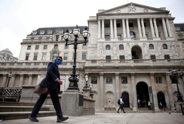 A person walks past the Bank of England in the City of London financial district, in London, Britain, on June 11, 2021. (Henry Nicholls/Reuters)