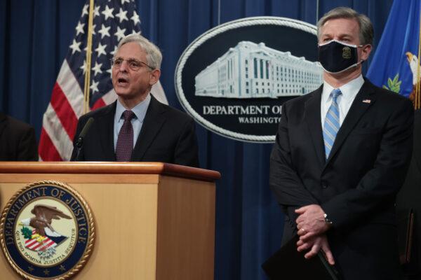 Attorney General Merrick Garland (L) and FBI Director Christopher Wray hold a press conference in Washington on Nov. 8, 2021. (Chip Somodevilla/Getty Images)