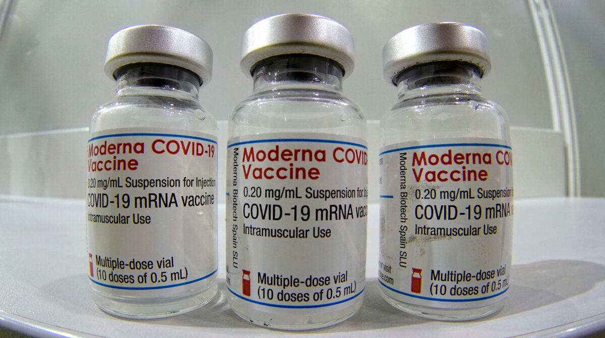 Three vials of the "Moderna COVID-19 Vaccine" at a new COVID-19 vaccination center at the "Velodrom" (velodrome-stadium) in Berlin, Germany, on Feb. 17, 2021. (Michael Sohn/Pool/Getty Images)