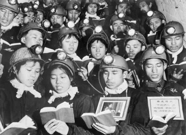 A group of male and female coal miners recite paragraphs of Mao Zedong's "Little Red Book" as they mark Mao's Great Proletarian Cultural Revolution in Li Se Yuan mine on Sept. 6, 1968. (Xinhua/AFP via Getty Images)