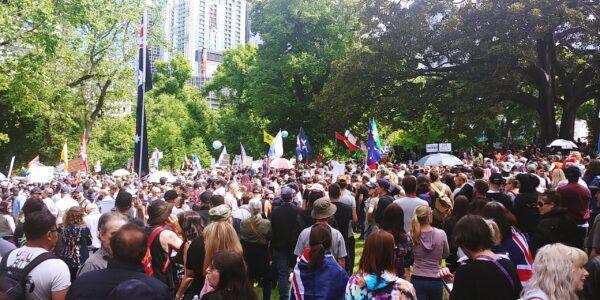 Tens of thousands of protesters with placards and flags at Flagstaff Gardens in Melbourne, Australia, on Nov. 20, 2021. (Alex Joseph/The Epoch Times)