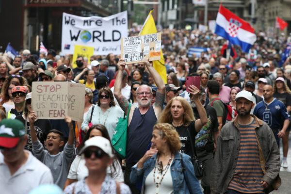 Protesters march along King Street during the 'World Wide Rally For Freedom' in Sydney, Australia, on Nov. 20, 2021. (Lisa Maree Williams/Getty Images)
