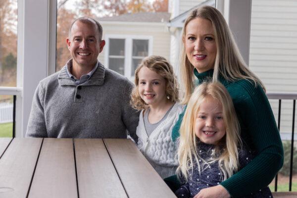 David and Jessica Mendez with daughters Deanna and Shelby at their residence in Aldie, Va., on Nov. 21, 2021. (Graeme Jennings for The Epoch Times)