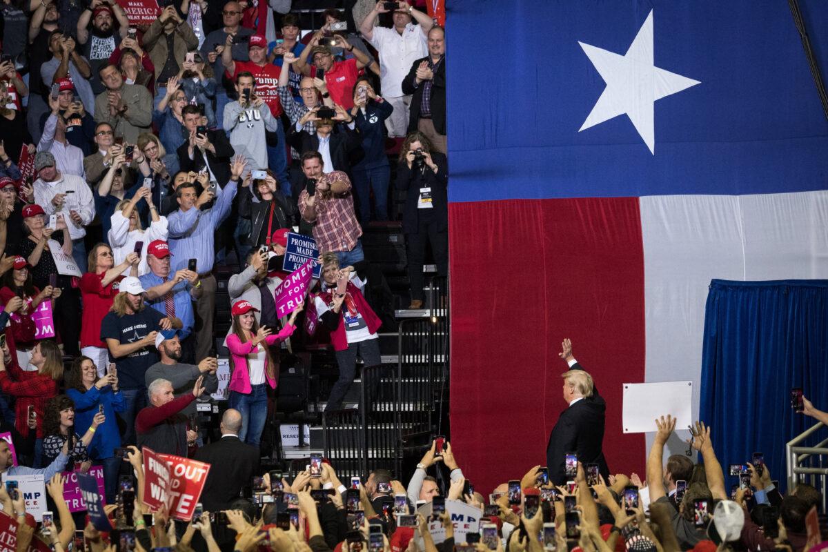 President Donald Trump takes the stage during a rally in support of Sen. Ted Cruz (R-Texas) at the Toyota Center in Houston on Oct. 22, 2018. (Loren Elliott/Getty Images)