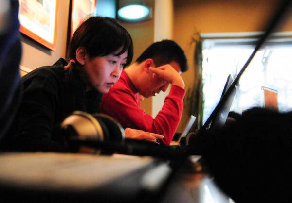 According to the 2007 Annual Report on China's Internet Network, the struggle for unrestricted online access by everyday Chinese internet users is getting more difficult as the Chinese Communist regime has stepped up its control of the internet. (Frederic J. Brown/AFP/Getty Images)