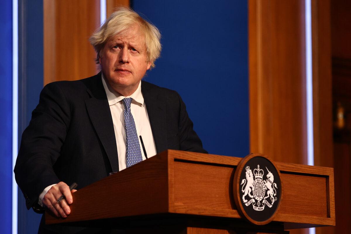 British Prime Minister Boris Johnson gives a press conference at 10 Downing Street on Dec. 8, 2021. (Adrian Dennis-WPA Pool/Getty Images)