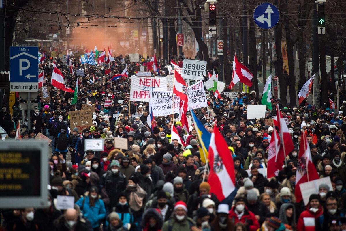 People protesting against lockdown measures and COVID-19 vaccinations march through the city center in Vienna, Austria, on Dec. 4, 2021. (Michael Gruber/Getty Images)