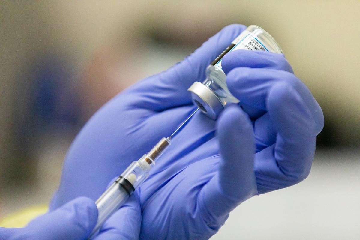 A COVID-19 Moderna vaccination being prepared at Lestonnac Free Clinic in Orange, Calif., on March 9, 2021. (John Fredricks/The Epoch Times)