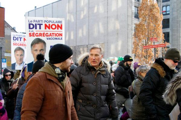 Maxime Bernier (C), leader of the People's Party of Canada, attends a protest against restrictive pandemic policies in Montreal on Jan. 8, 2022. (Noé Chartier/The Epoch Times)