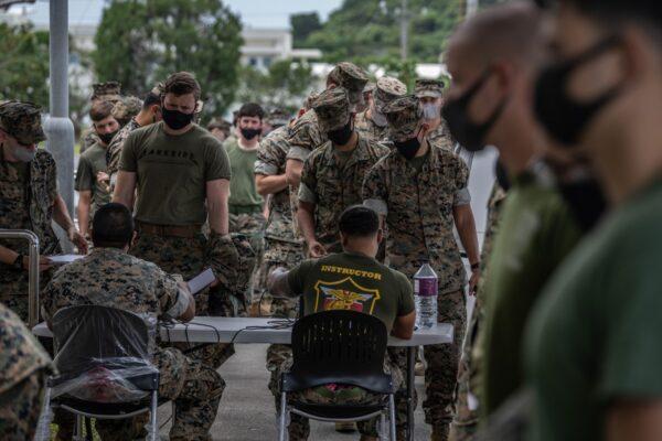 United States Marines queue to receive the Moderna coronavirus vaccine at Camp Hansen in Kin, Japan on April 28, 2021. (Carl Court/Getty Images)