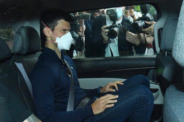 Serbian tennis player Novak Djokovic rides in a car as he leaves a government detention facility before attending a court hearing at his lawyer's office in Melbourne, Australia, on Jan. 16, 2022. (James Ross/AAP via AP)