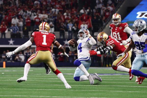 Dak Prescott #4 of the Dallas Cowboys scrambles with the ball on the last play of the game against the San Francisco 49ers during the fourth quarter in the NFC Wild Card Playoff game at AT&T Stadium, Texas, on January 16, 2022. (Tom Pennington/Getty Images)
