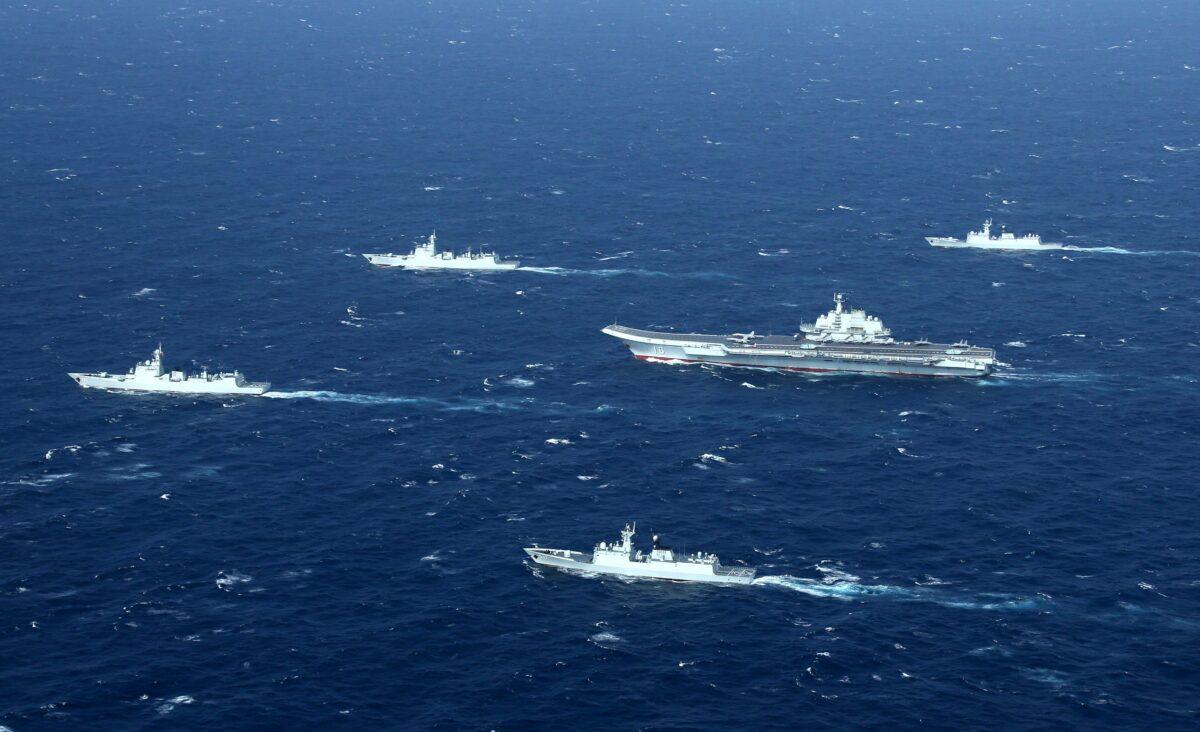 A Chinese navy formation, including the aircraft carrier Liaoning (C), during military drills in the South China Sea, in an aerial photo taken on Jan. 2, 2017. (STR/AFP via Getty Images)