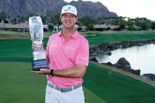 Hudson Swafford holds the winner's trophy at the end of the American Express golf tournament on the Pete Dye Stadium Course at PGA West in La Quinta, Calif., on Jan. 23, 2022. (Marcio Jose Sanchez/AP Photo)