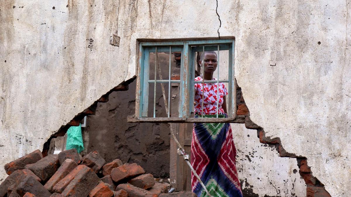 A woman looks on at her house destroyed by tropical storm Ana at Kanjedza village, in Chikwawa district, southern Malawi, on Jan. 26, 2022. (Eldson Chagara/Reuters)