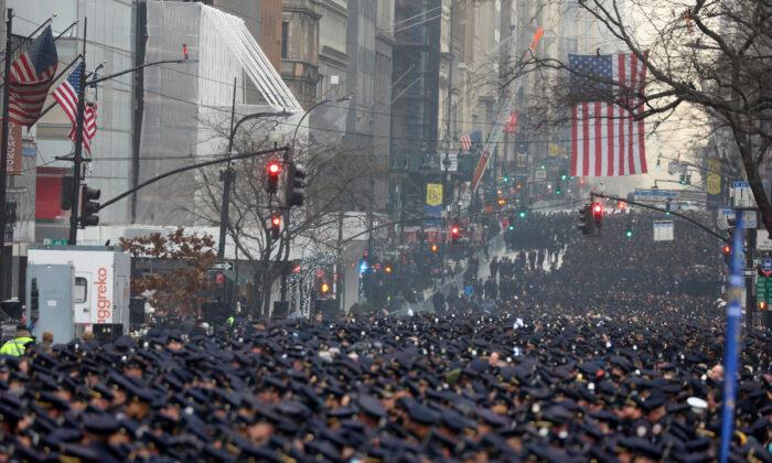 New York Police officers gather along Fifth Avenue for the funeral of Officer Jason Rivera, outside St. Patrick’s Cathedral in New York on Jan. 28, 2022. (Yuki Iwamura/AP Photo)