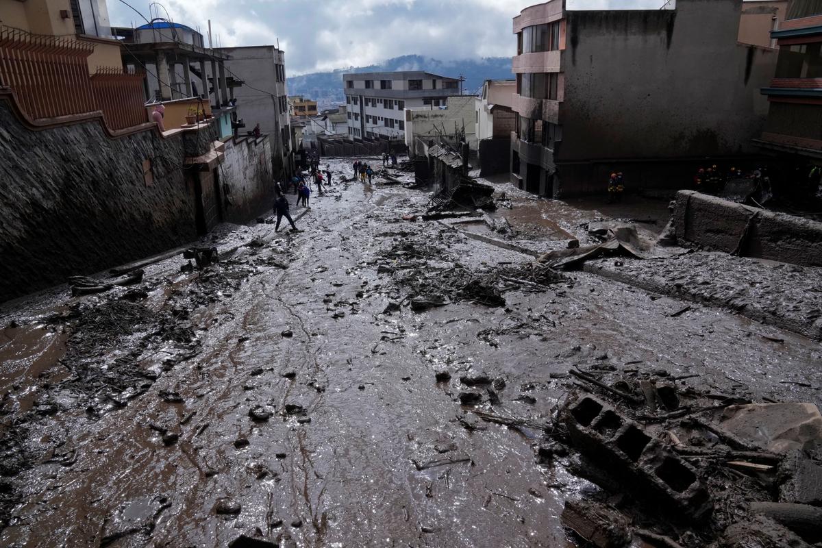 Mud fills a street after a rain-weakened hillside collapsed and brought waves of mud over La Gasca area of Quito, Ecuador, on Feb. 1, 2022. (Dolores Ochoa/AP Photo)