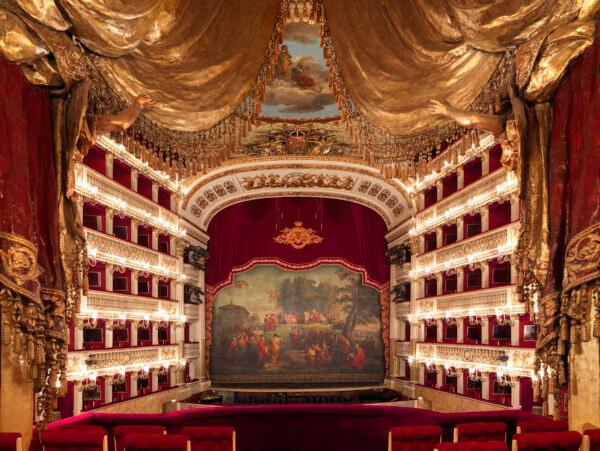 The Royal Box is centrally positioned, offering a prime view of the stage. The sculpted gold and red drapery frame the view from within. (Luciano Romano/Teatro di San Carlo)
