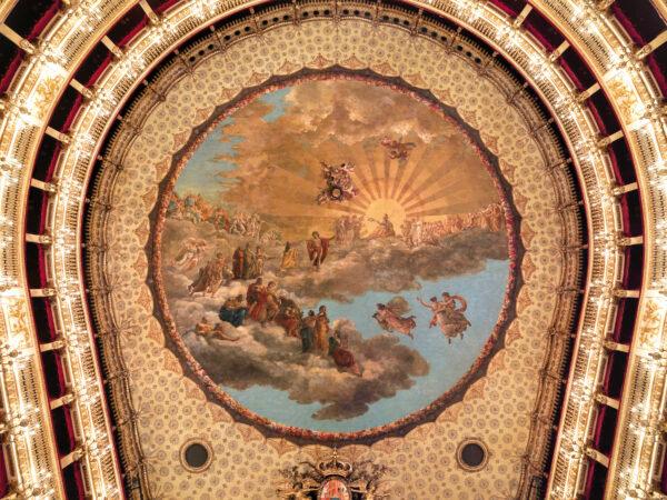 The ceiling fresco invites guests to enter a heavenly realm. The center of the ceiling is decorated with a painting by Antonio, Giuseppe, and Giovanni Cammarano, “Apollo Introducing the Greatest Poets in the World to Minerva.” (Luciano Romano/Teatro di San Carlo)